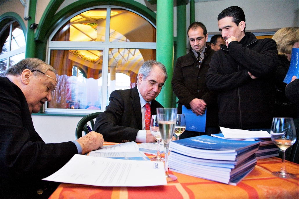 Jean Louis Baroux, founder of APG, signing airline partnership contracts during the company's early years.